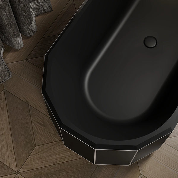 Close-up of matte black Beryl Series bathtub featuring a smooth white rim
