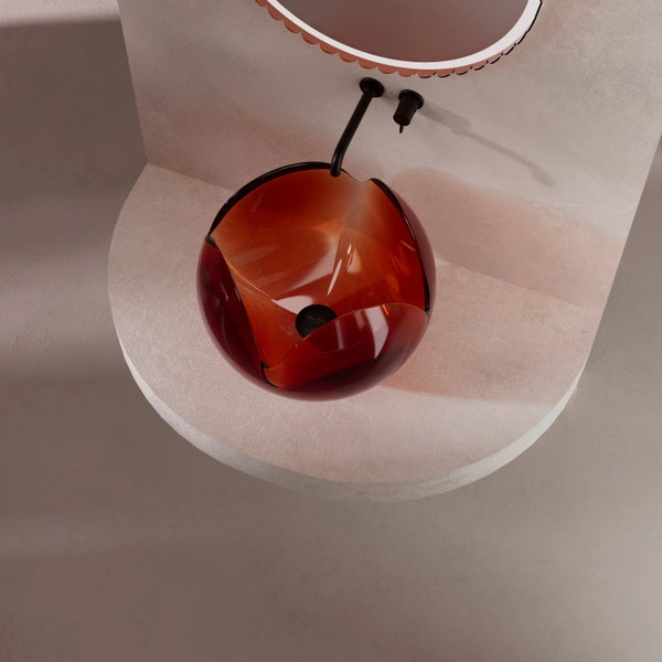 Elegant transparent countertop washbasin with sculptural flower motif and minimalist aesthetic