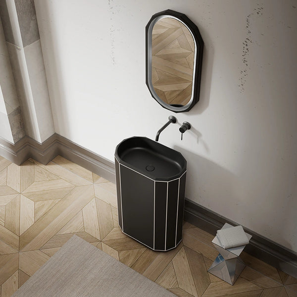 Matte black geometric pedestal sink with white edge in modern luxury bathroom