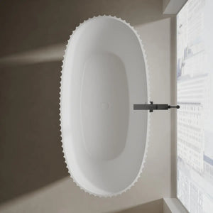 Modern white curved freestanding bathtub with fluted design