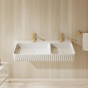 Luxury double wall hung bathroom sink with seamless solid surface construction and architectural fluted front