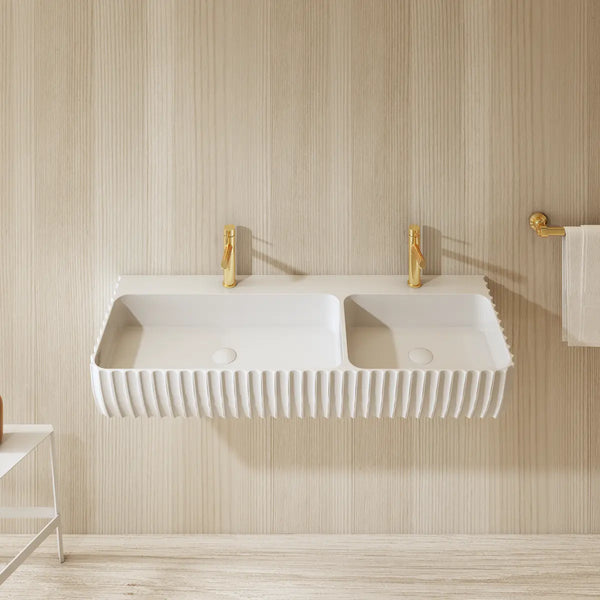 Luxury double wall hung bathroom sink with seamless solid surface construction and architectural fluted front