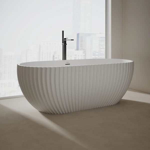 White fluted curved freestanding soaking tub with double ended design